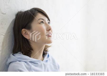Young lady leaning on the wall Young lady leaning on the wall 18133383