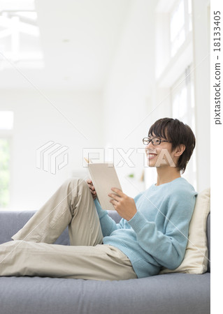 A young man with a book with a smile 18133405