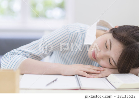 A Young Woman Who Fells Down On Her Desk And Stock Photo