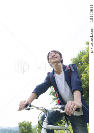 Young man riding a bicycle 18133651