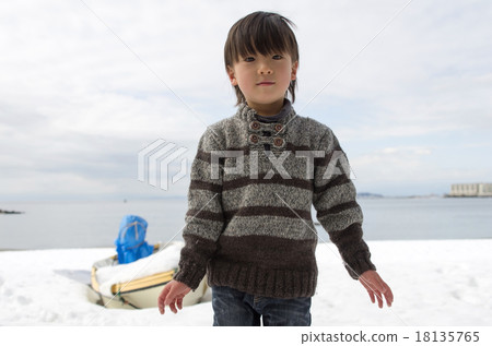 Coastal background with children and snow remaining 18135765