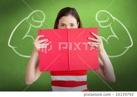 Composite image of student holding book over face 18139792