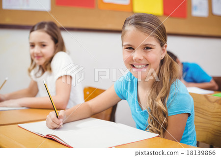 Pupils working at their desk in class Pupils working at their desk in class 18139866