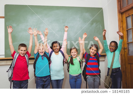 Students with arms raised together 18140185