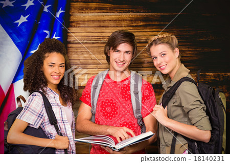 Composite image of college students reading book in library Composite image of college students reading book in library 18140231