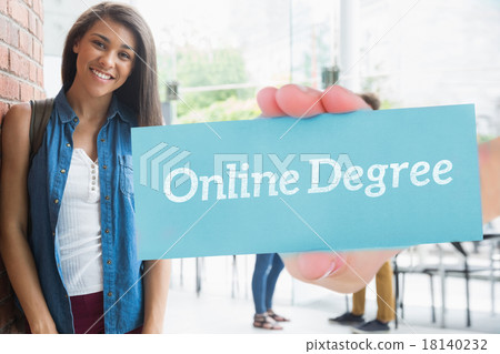 Online degree against pretty student smiling at camera with clas 18140232