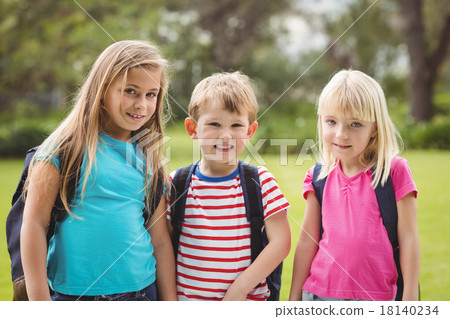 Smiling classmates with schoolbags Smiling classmates with schoolbags 18140234