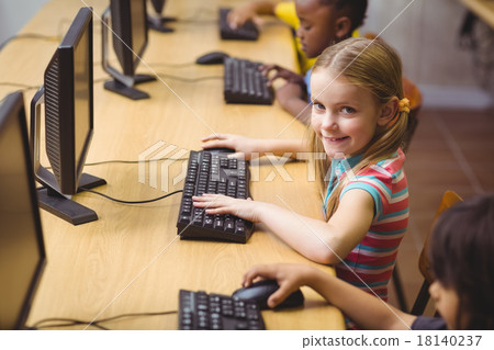 Cute pupils in computer class 18140237