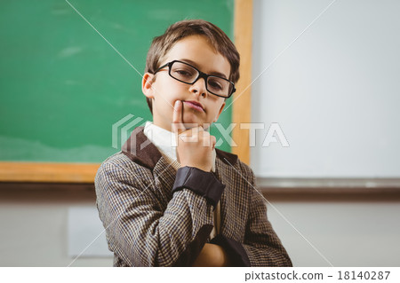 Pupil dressed up as teacher thinking Pupil dressed up as teacher thinking 18140287