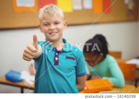 Smiling student with thumbs up 18140299