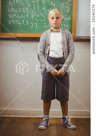 Pupil dressed up as teacher in front of chalkboard Pupil dressed up as teacher in front of chalkboard 18140374