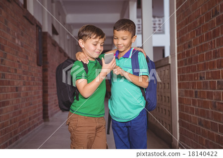 Students using a mobile phone 18140422