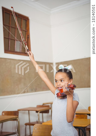 Student using a violin in class Student using a violin in class 18140501