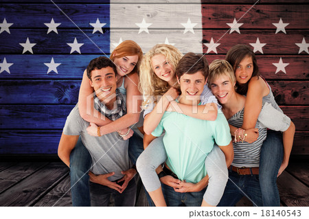 Composite image of teenagers giving their friends piggyback ride 18140543