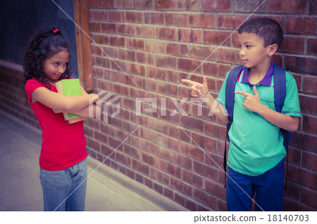 Upset child being teased by another child Upset child being teased by another child 18140703