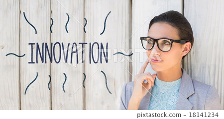 Innovation against stylish brunette thinking and smiling 18141234