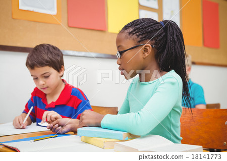Student helping fellow student in class 18141773