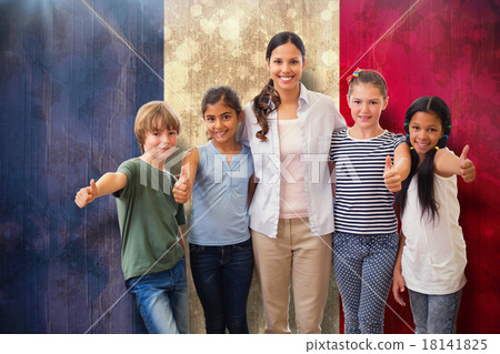 Composite image of cute pupils and teacher smiling at camera in computer class 18141825