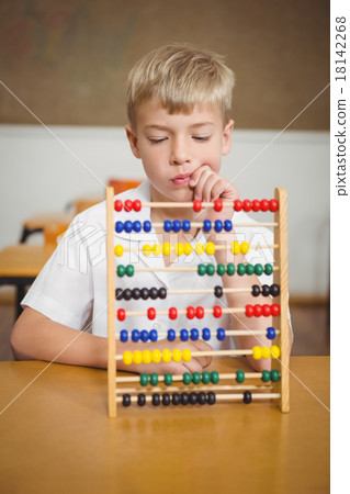 Student using a maths abacus 18142268
