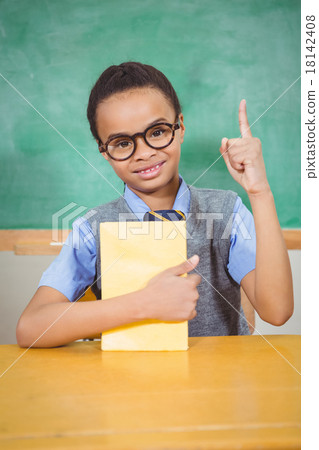 Smart student raising hand to answer a question 18142408