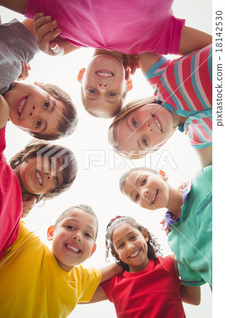 Cute pupils in a huddle 18142530
