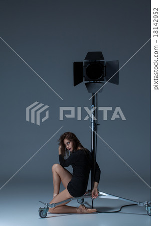 The beautiful ballerina posing on dack blue 18142952