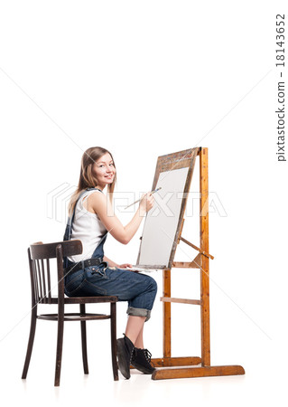 Young smiling woman painter with paintbrush 18143652
