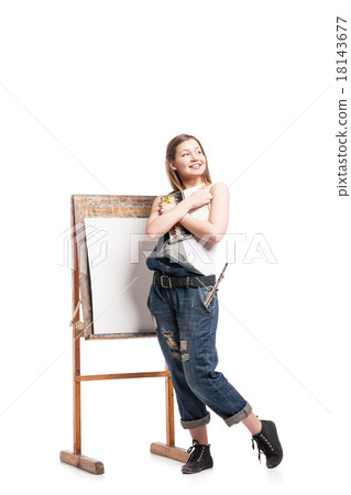 Young smiling woman  standing at easel , hugging 18143677