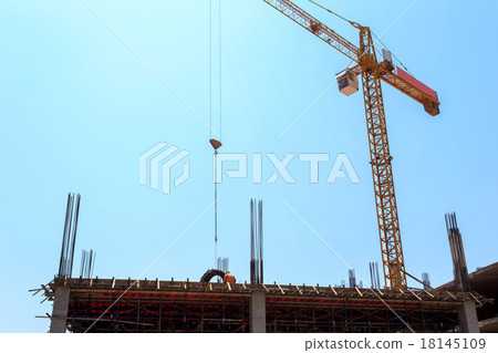 Building crane and construction site under blue sky Building crane and construction site under blue sky 18145109