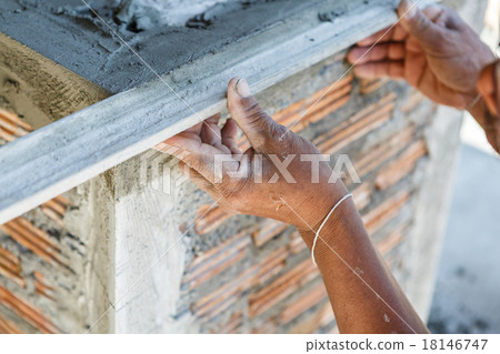 plasterer concrete worker at wall of house construction plasterer concrete worker at wall of house construction 18146747