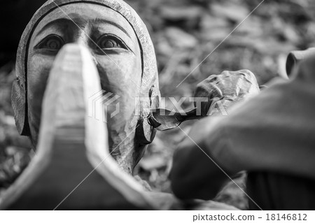 Hand of carver carving wood in blackand white color tone 18146812