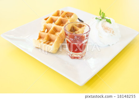 Strawberry Waffle whipped Cream on yellow desk Strawberry Waffle whipped Cream on yellow desk 18148255