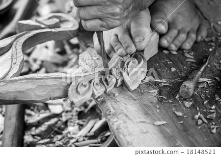 Hand of carver carving wood in black and white color tone Hand of carver carving wood in black and white color tone 18148521