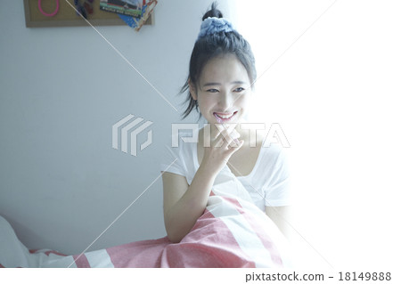 A woman in her room A woman in her room 18149888