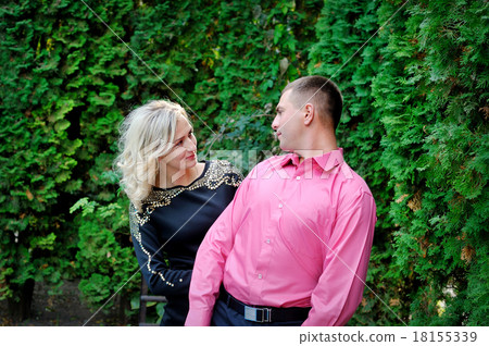Portrait of a happy couple embracing while in the park 18155339