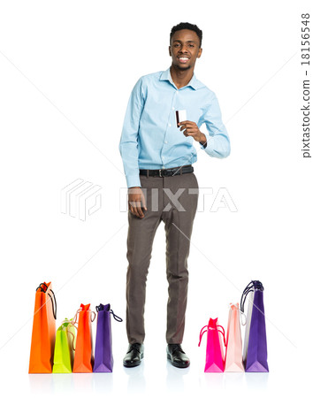Happy african american man with shopping bags and holding credit Happy african american man with shopping bags and holding credit 18156548