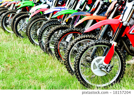 Motocross riders lined up before start on the race 18157204