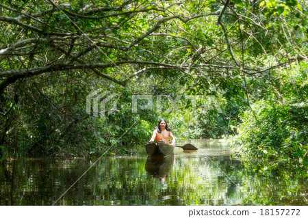 Indigenous Man With Canoe In Amazon Basin 18157272