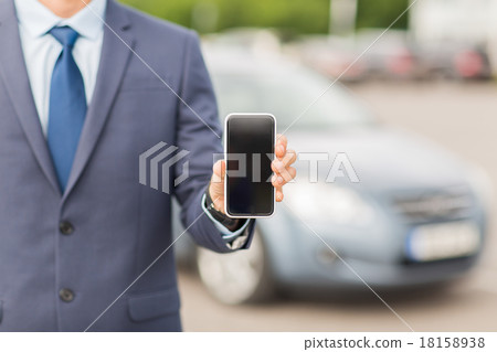 close up of business man with smartphone and car close up of business man with smartphone and car 18158938