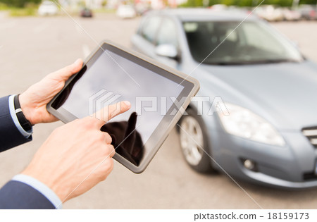 close up of young man with tablet pc and car close up of young man with tablet pc and car 18159173