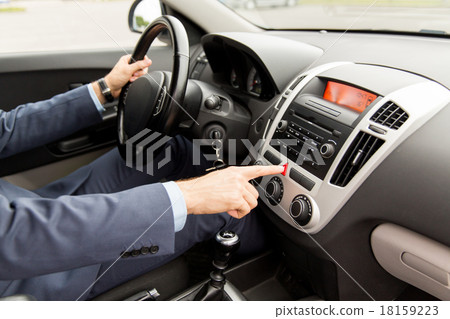close up of man driving car and emergency button 18159223