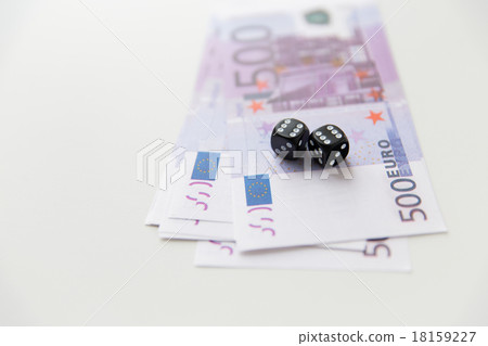 close up of black dice and euro cash money close up of black dice and euro cash money 18159227