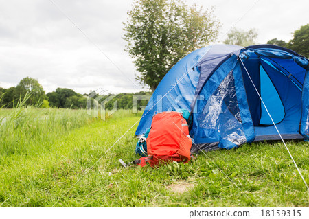 touristic tent and backpack outdoors 18159315