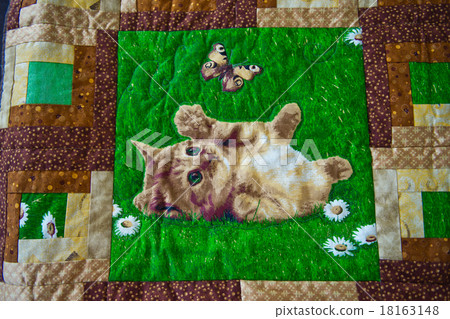 Photo of a kitten embroidered on a cover 2964. Photo of a kitten embroidered on a cover 2964. 18163148