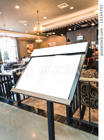 White menu board in front of the restaurant. 18169703