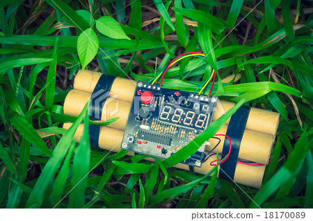 TNT time bomb on grass ( Filtered image processed vintage effec TNT time bomb on grass ( Filtered image processed vintage effec 18170089