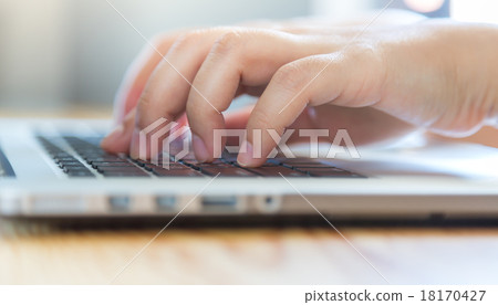 Closeup of business woman hand typing on laptop keyboard Closeup of business woman hand typing on laptop keyboard 18170427