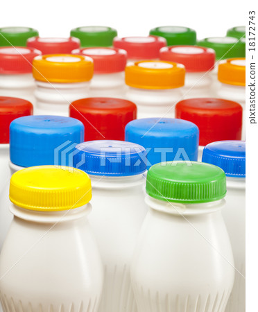 dairy products bottles with bright covers 18172743