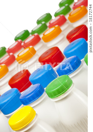 dairy products bottles with bright covers 18172744