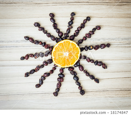 Happy sun made of rosehips and orange 18174847